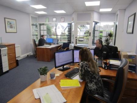 Janice, Bing and Gary busy in the office